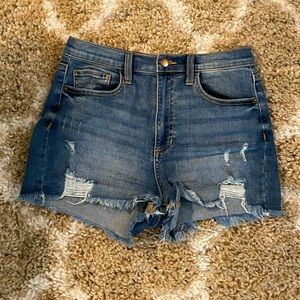 High-waisted distressed jean shorts